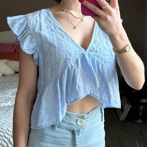 Blue ruffled blouse